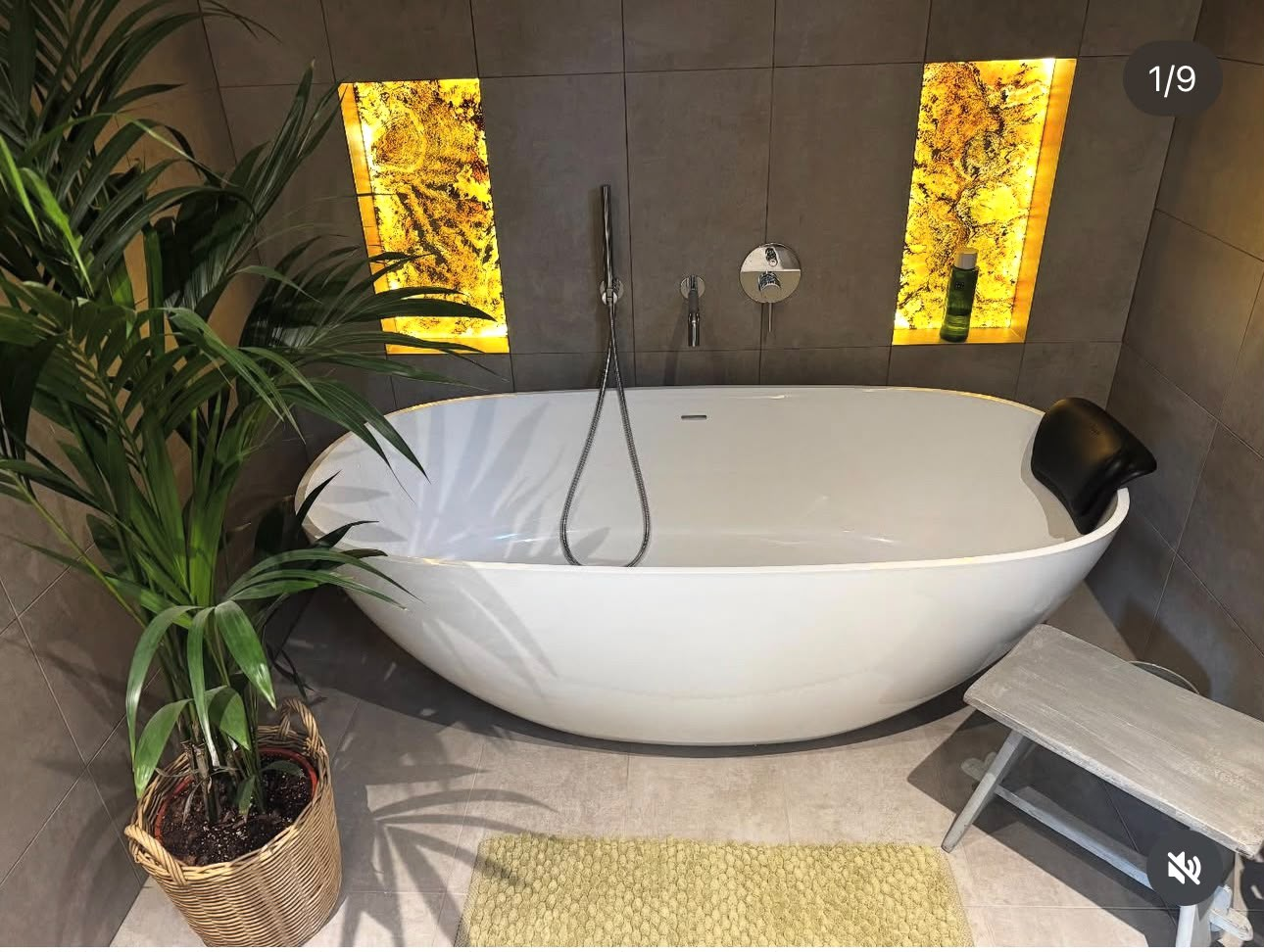 Modern bathroom installation with walk-in shower and brushed brass fittings