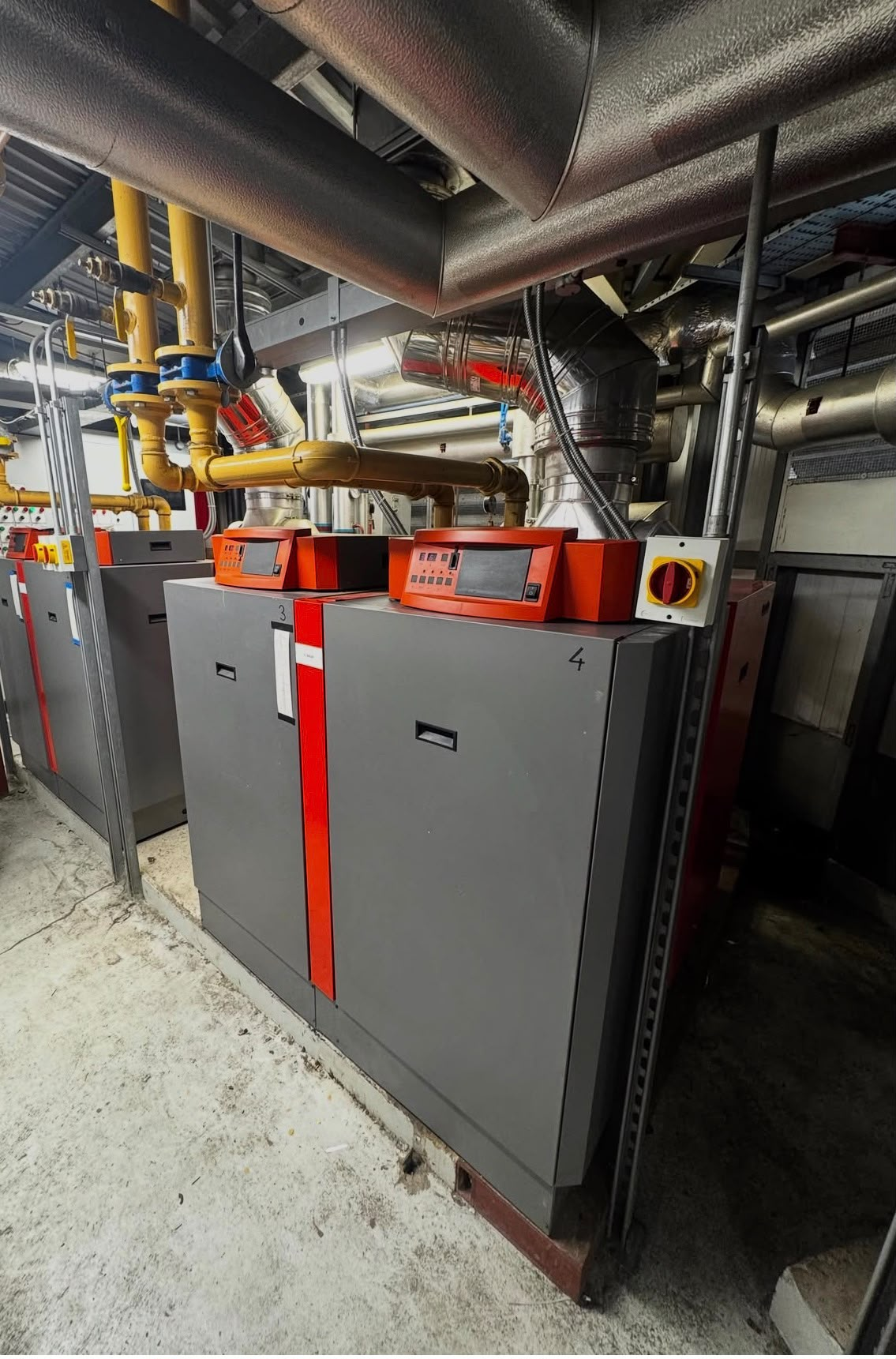 Commercial plant room with cascade boilers and pipework